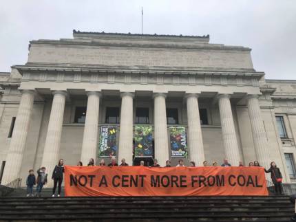 350 Auckland in front of Auckland Museum with a banner reading 'Not a cent more from coal'