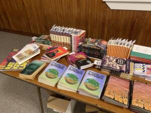 Photo of a whole lot of books on table. Rito Tōrangapū library